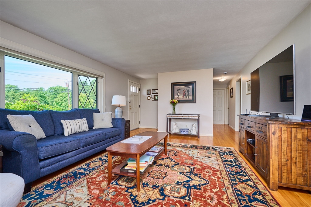 985 Tinkham Road Wilbraham, MA 01095 - Photo 13 of 27 a living room with furniture and a flat screen tv