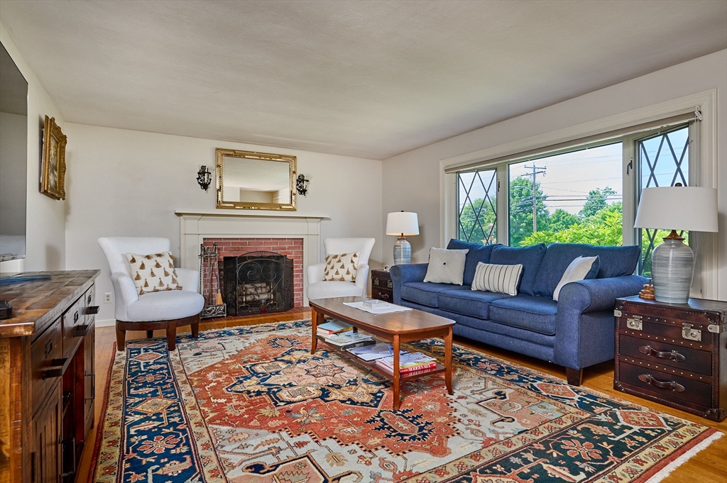 985 Tinkham Road Wilbraham, MA 01095 - Photo 14 of 27 a living room with furniture and a fireplace