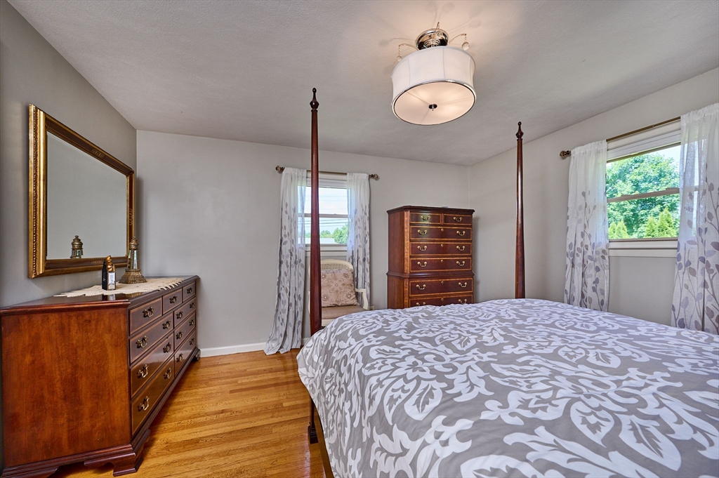 985 Tinkham Road Wilbraham, MA 01095 - Photo 15 of 27 a bedroom with a bed and a dresser
