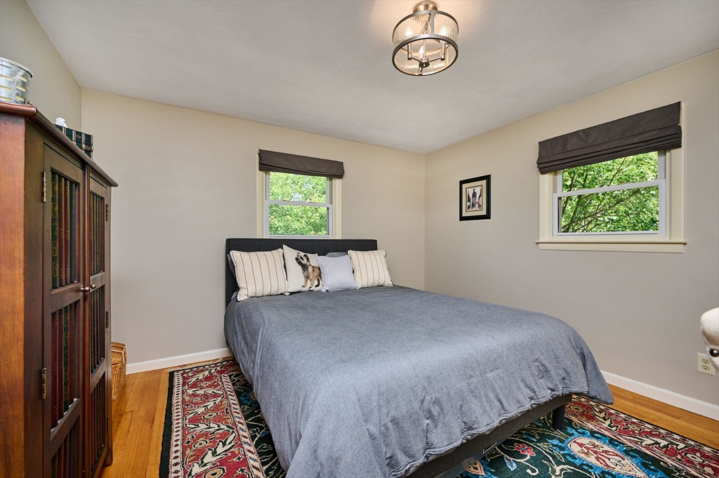 985 Tinkham Road Wilbraham, MA 01095 - Photo 17 of 27 a bed sitting in a bedroom next to a window