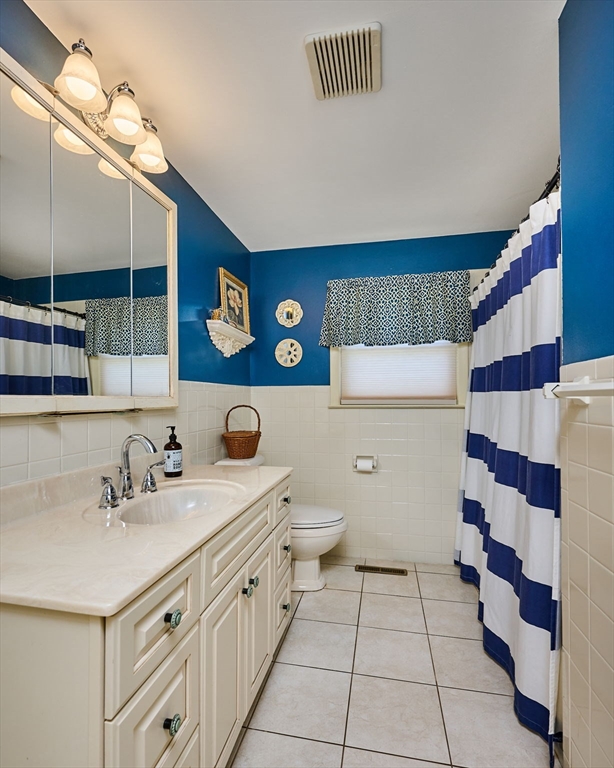 985 Tinkham Road Wilbraham, MA 01095 - Photo 19 of 27 a bathroom with a sink a toilet and shower