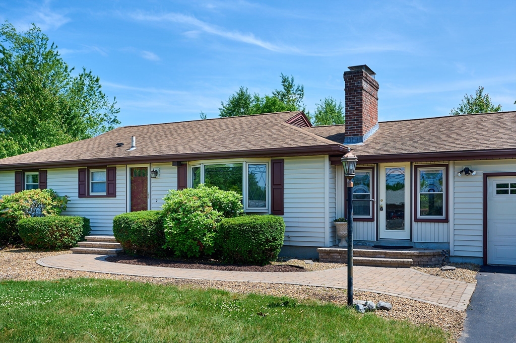 985 Tinkham Road Wilbraham, MA 01095 - Photo 2 of 27 a front view of a house with garden