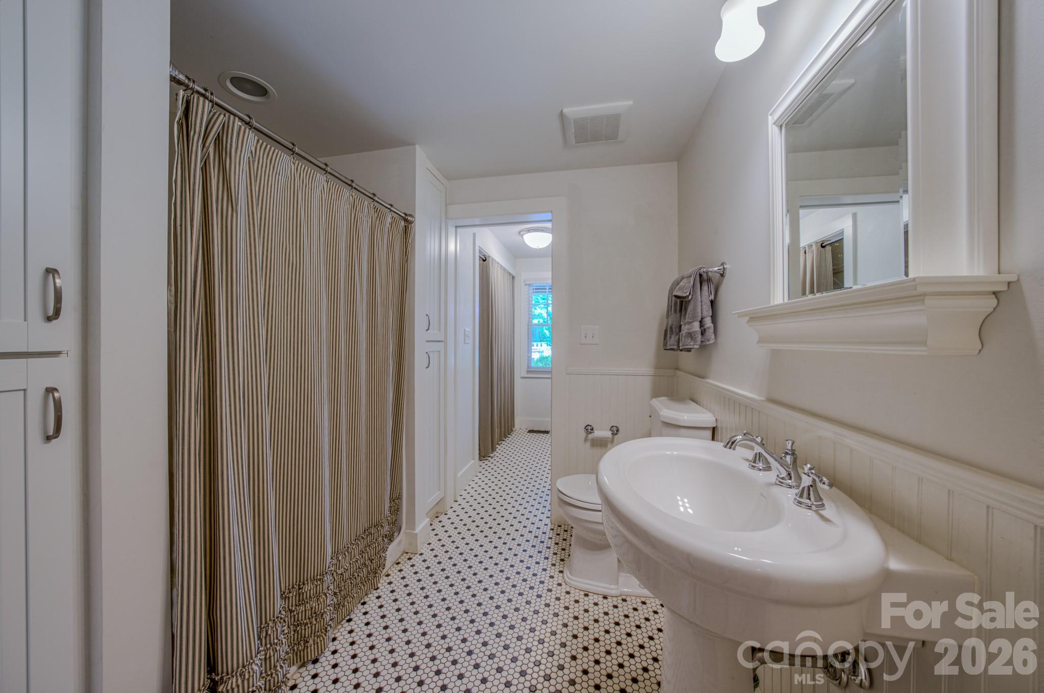 75 Old Gap Creek Road Fairview, NC 28730 - Photo 30 of 43 a bathroom with a sink and a mirror
