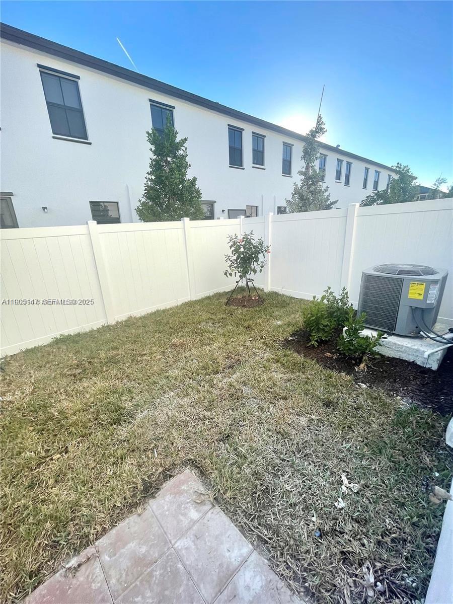 3338 West 112th Street Hialeah, FL 33018 - Photo 14 of 40 a view of a house with a backyard