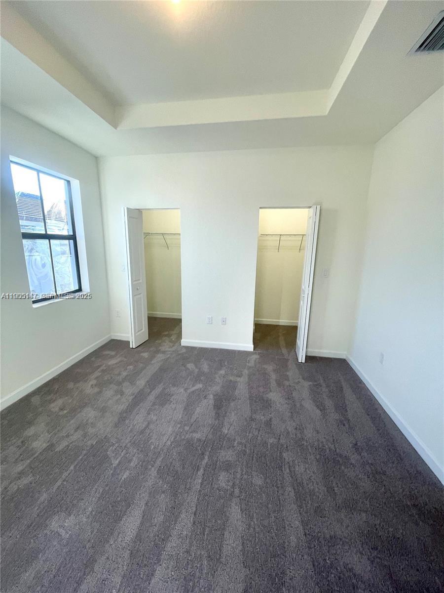 3338 West 112th Street Hialeah, FL 33018 - Photo 17 of 40 an empty room with windows