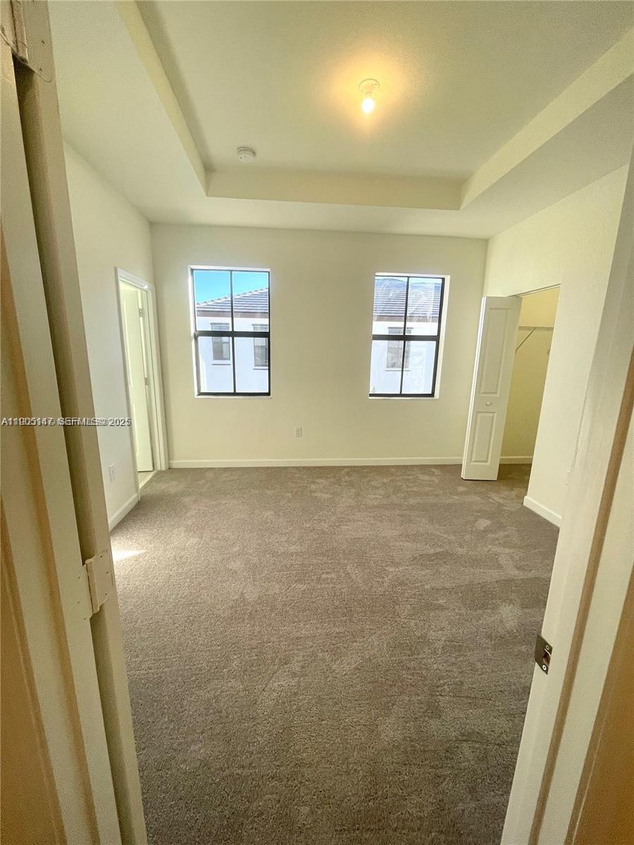 3338 West 112th Street Hialeah, FL 33018 - Photo 18 of 40 en empty room with windows