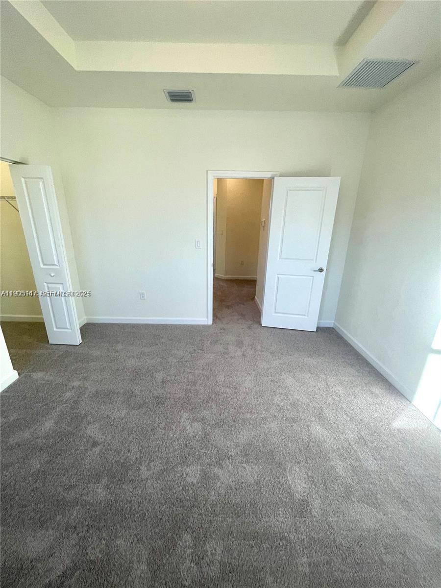 3338 West 112th Street Hialeah, FL 33018 - Photo 21 of 40 an empty room with a fireplace