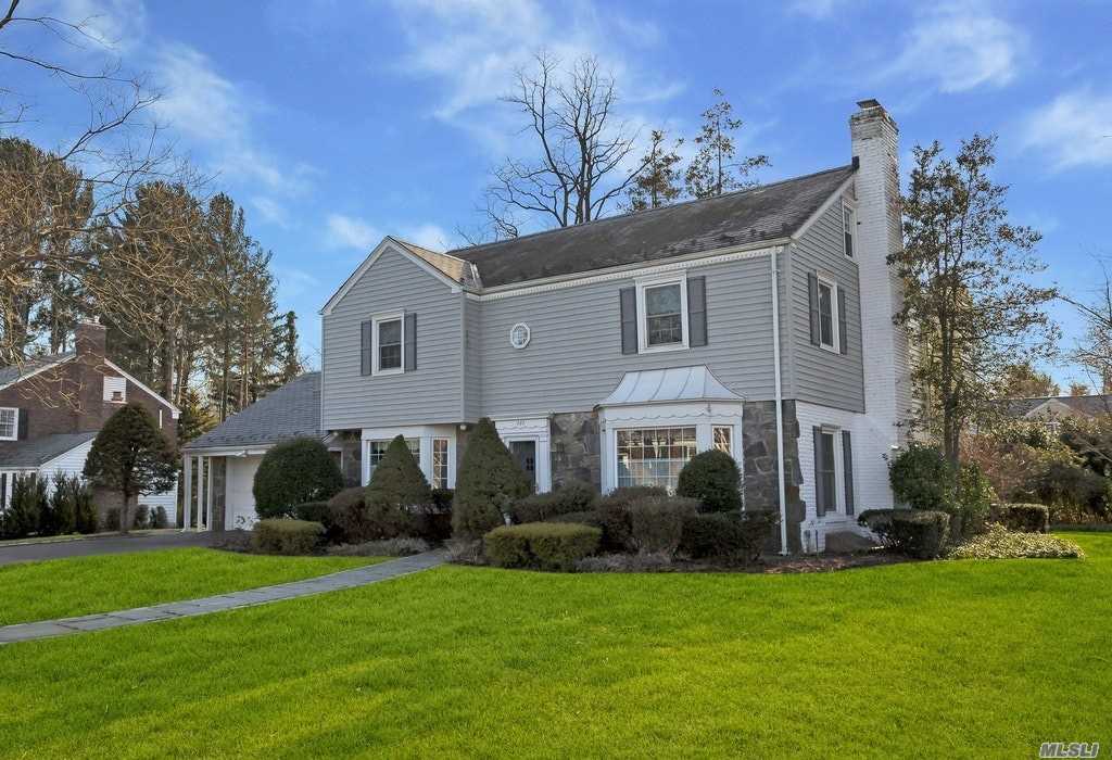 222 Trumbull Road Manhasset, NY 11030 - Photo 1 of 1 a front view of a house with a garden