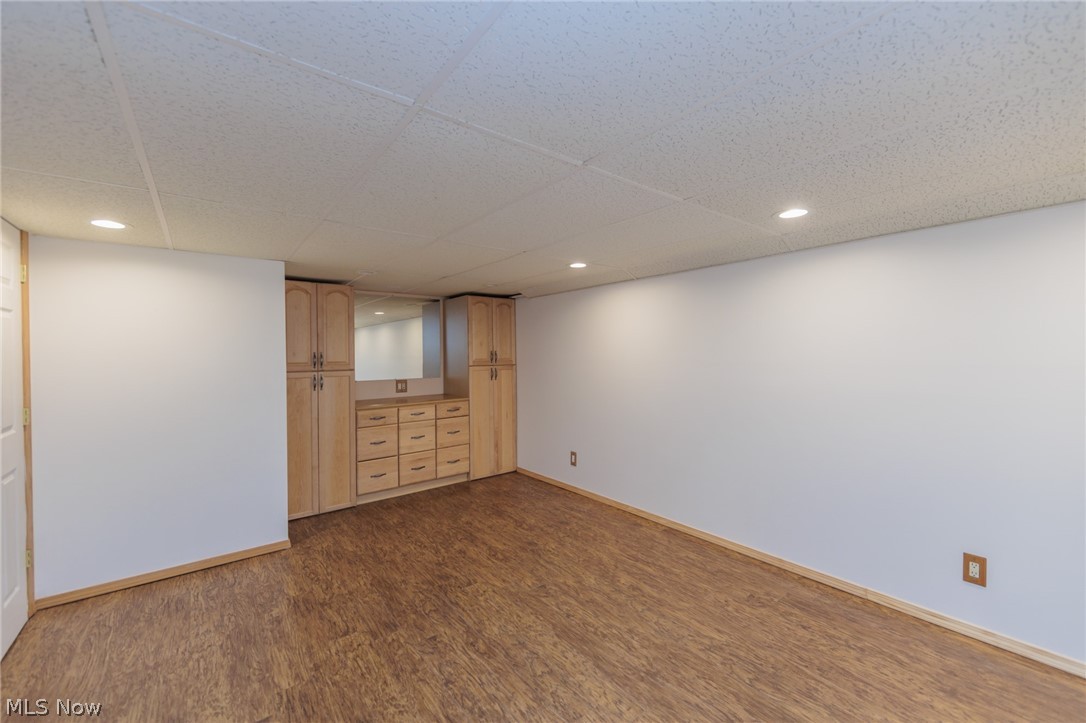 38565 Sugar Ridge Road North Ridgeville, OH 44039 - Photo 46 of 49 Spare room featuring dark hardwood / wood-style flooring and a paneled ceiling