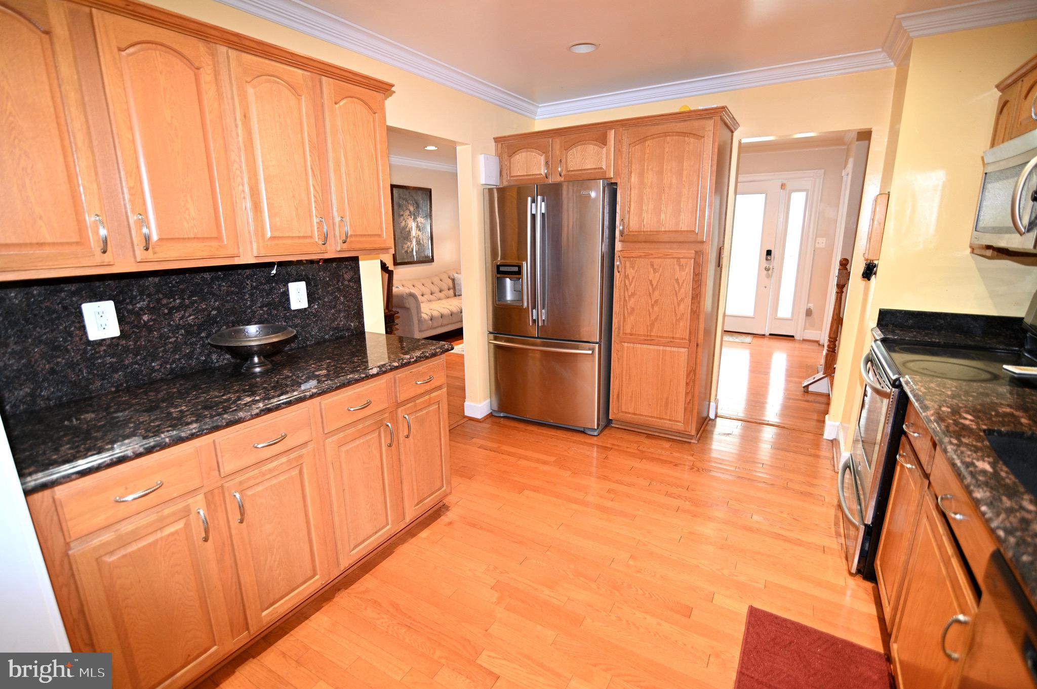 3407 Wayneswood Road Fort Washington, MD 20744 - Photo 13 of 70 a kitchen with stainless steel appliances granite countertop a refrigerator and a stove top oven