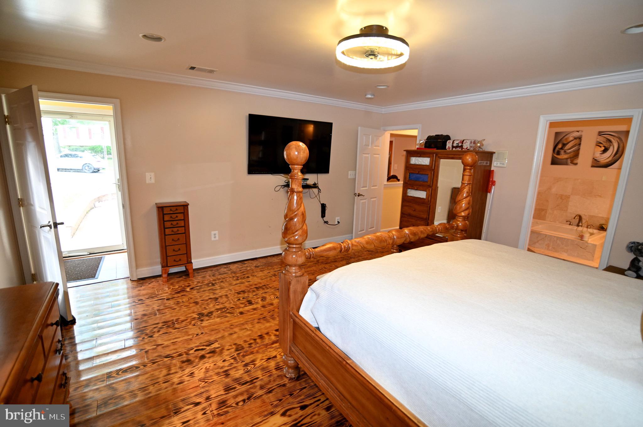3407 Wayneswood Road Fort Washington, MD 20744 - Photo 17 of 70 a bedroom with a bed and a flat screen tv