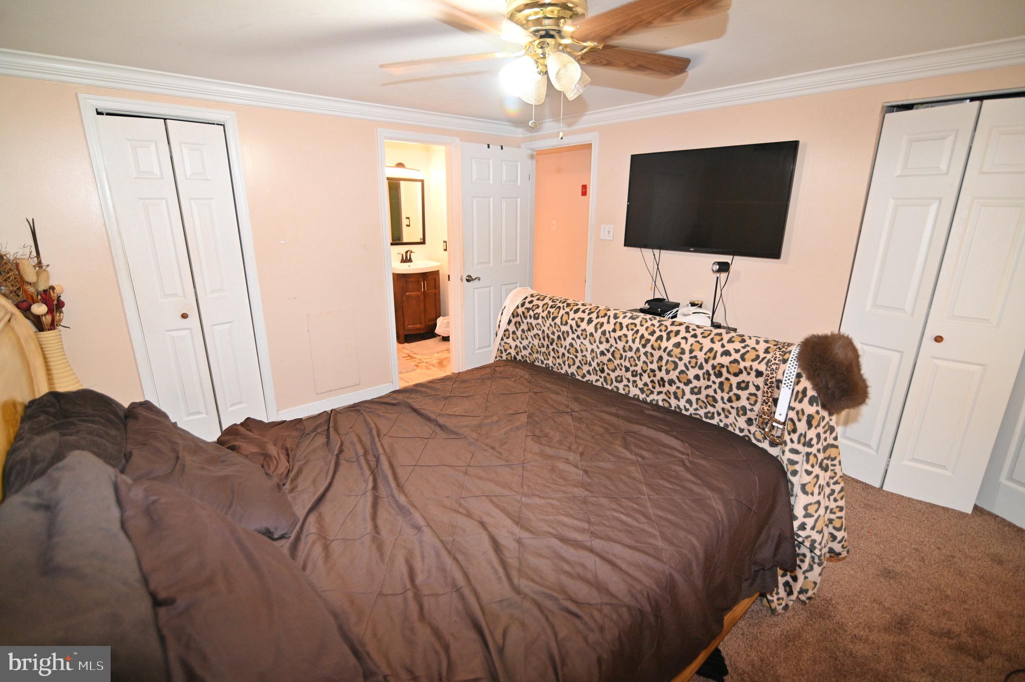3407 Wayneswood Road Fort Washington, MD 20744 - Photo 26 of 70 a bedroom with a bed and a flat screen tv