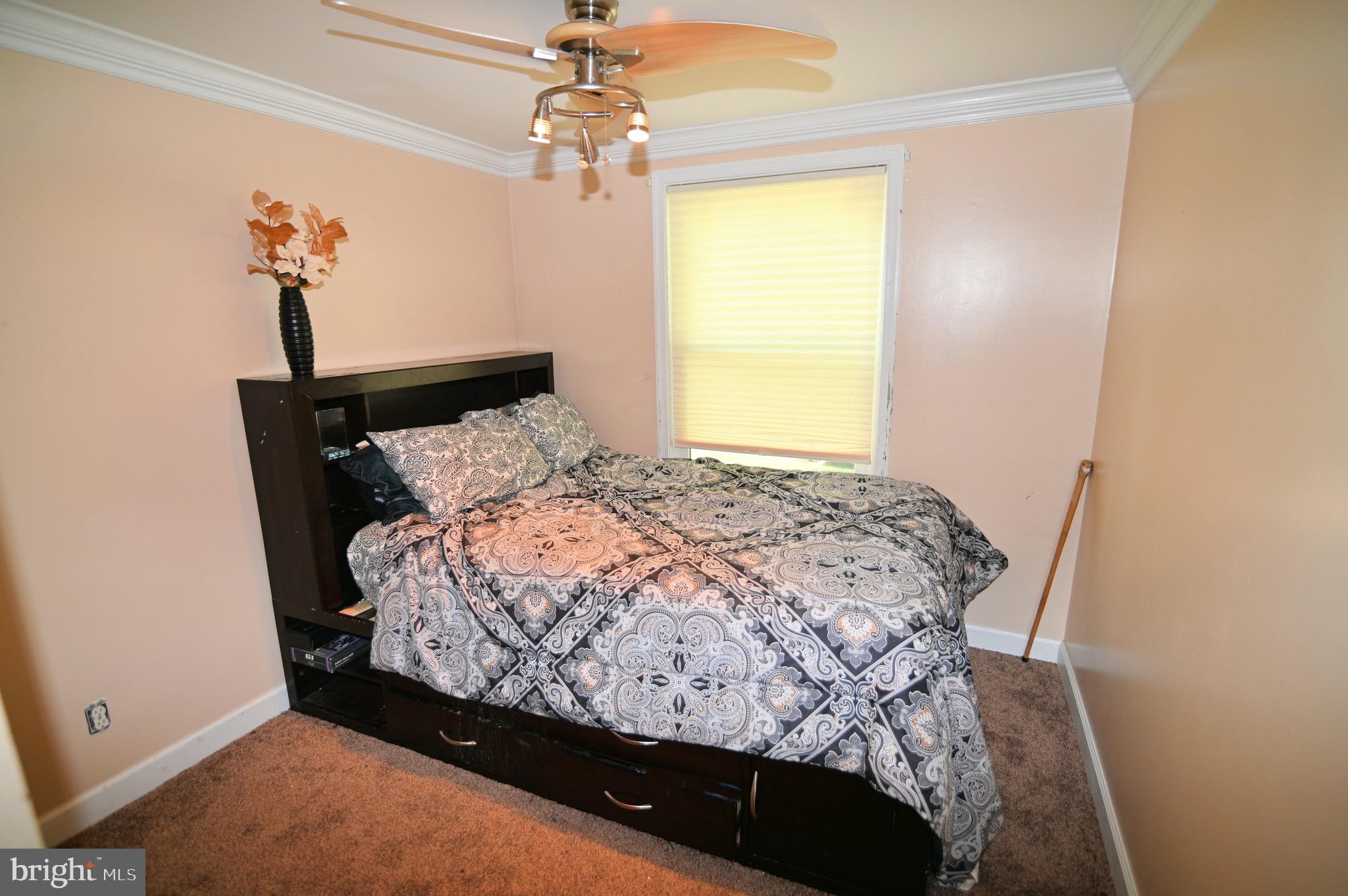 3407 Wayneswood Road Fort Washington, MD 20744 - Photo 27 of 70 a bed sitting in a bedroom next to a window