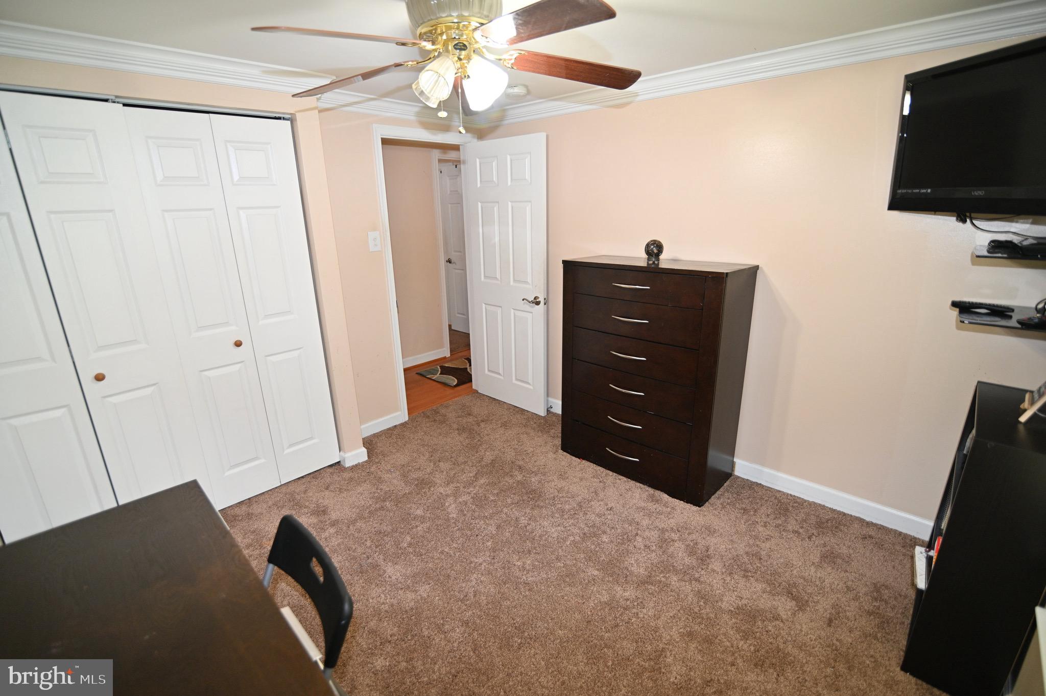 3407 Wayneswood Road Fort Washington, MD 20744 - Photo 29 of 70 a bedroom with a bed and a flat screen tv