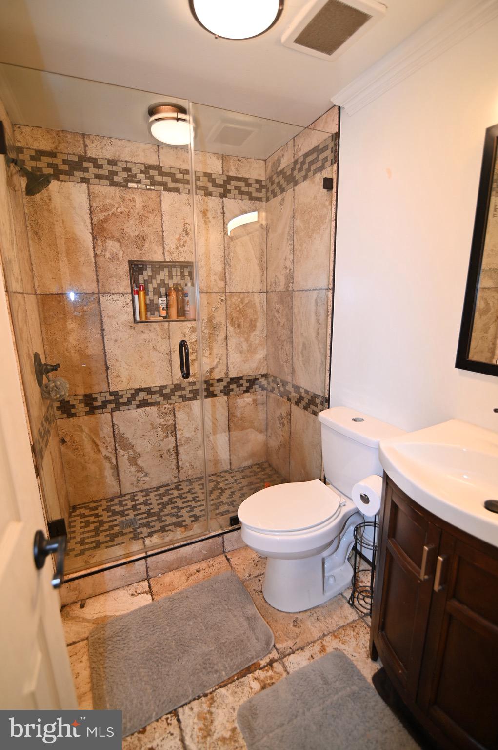 3407 Wayneswood Road Fort Washington, MD 20744 - Photo 31 of 70 a bathroom with a toilet sink and shower