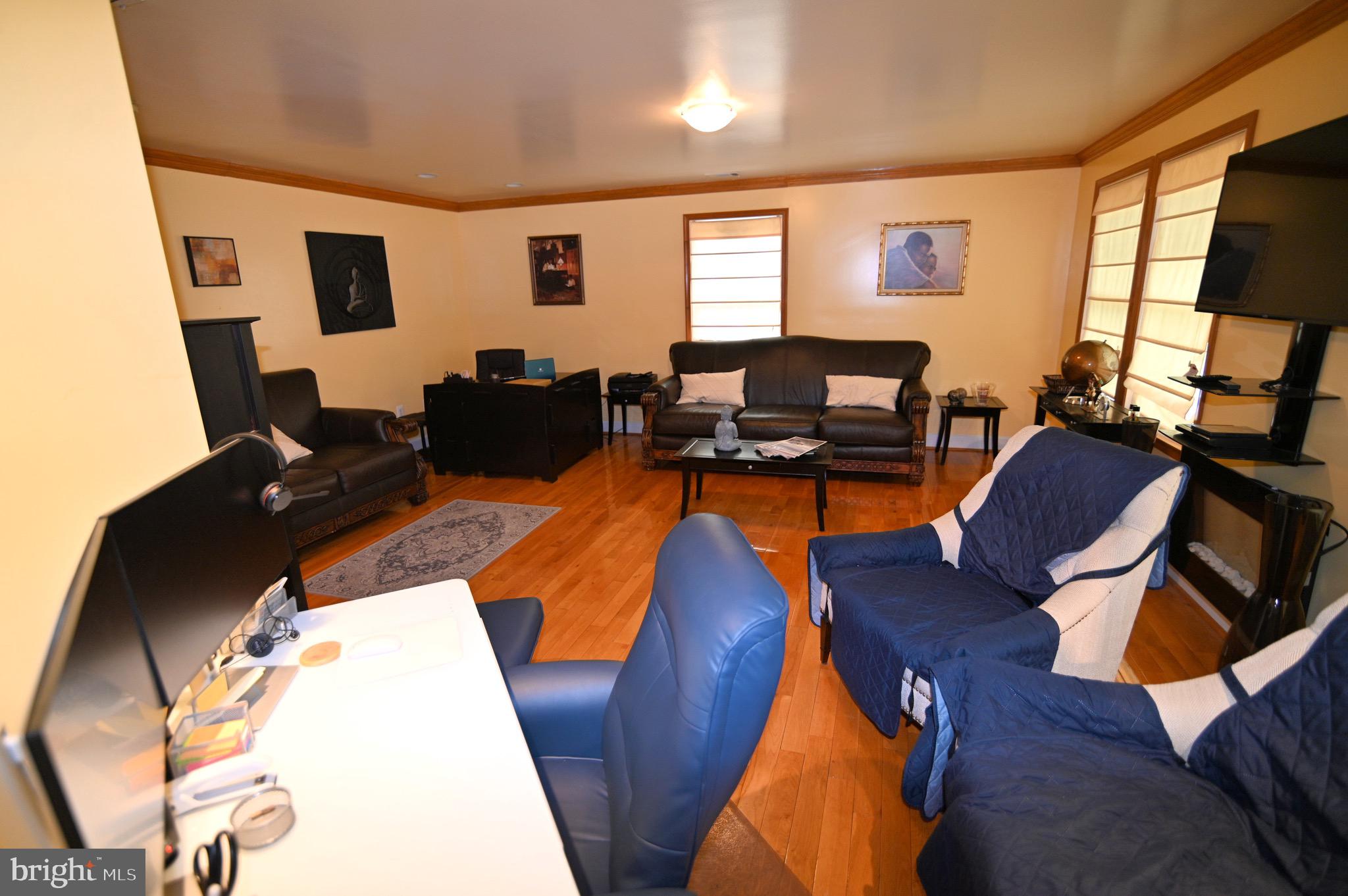 3407 Wayneswood Road Fort Washington, MD 20744 - Photo 35 of 70 a living room with furniture and a flat screen tv