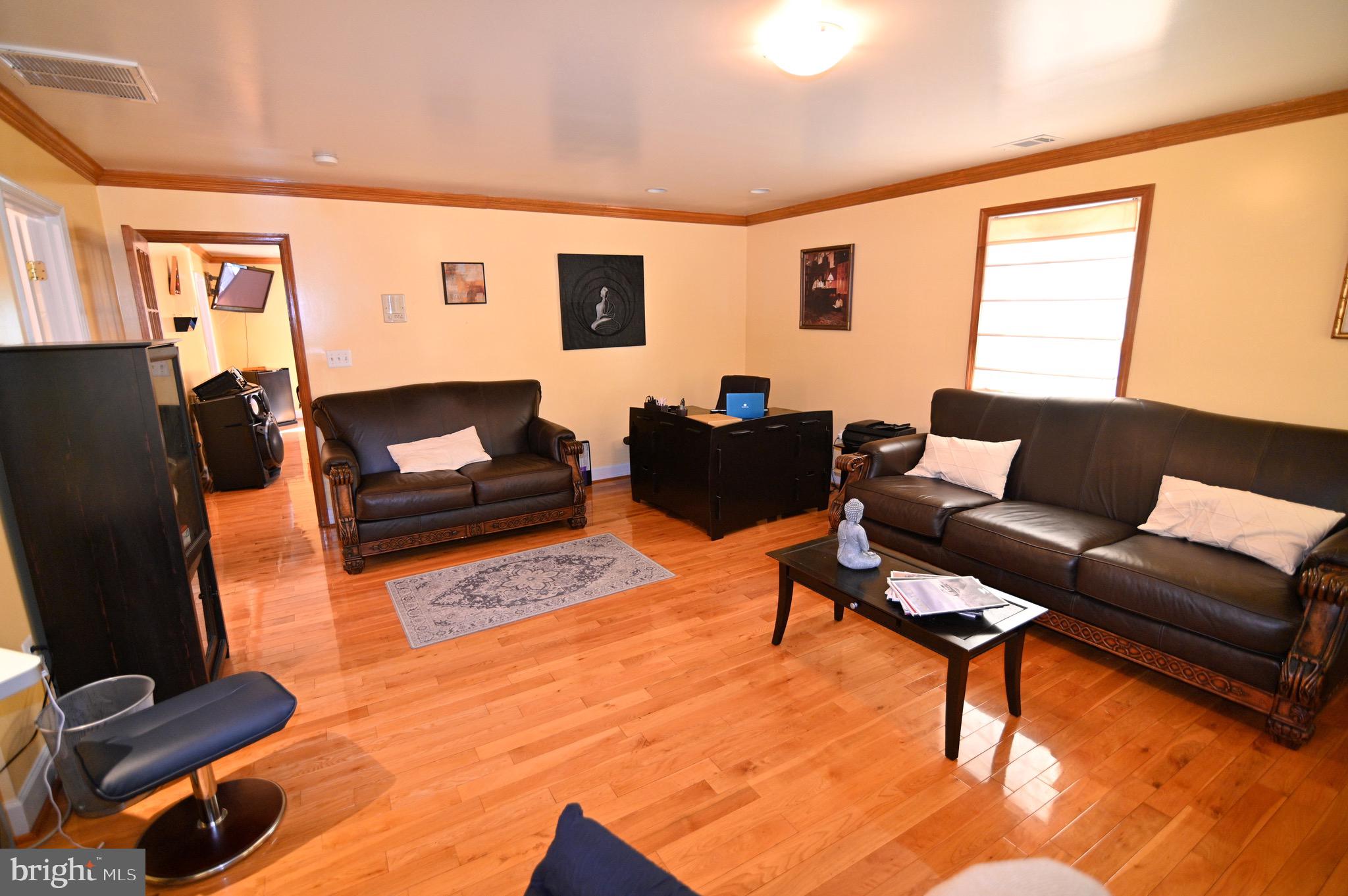 3407 Wayneswood Road Fort Washington, MD 20744 - Photo 36 of 70 a living room with furniture and a flat screen tv