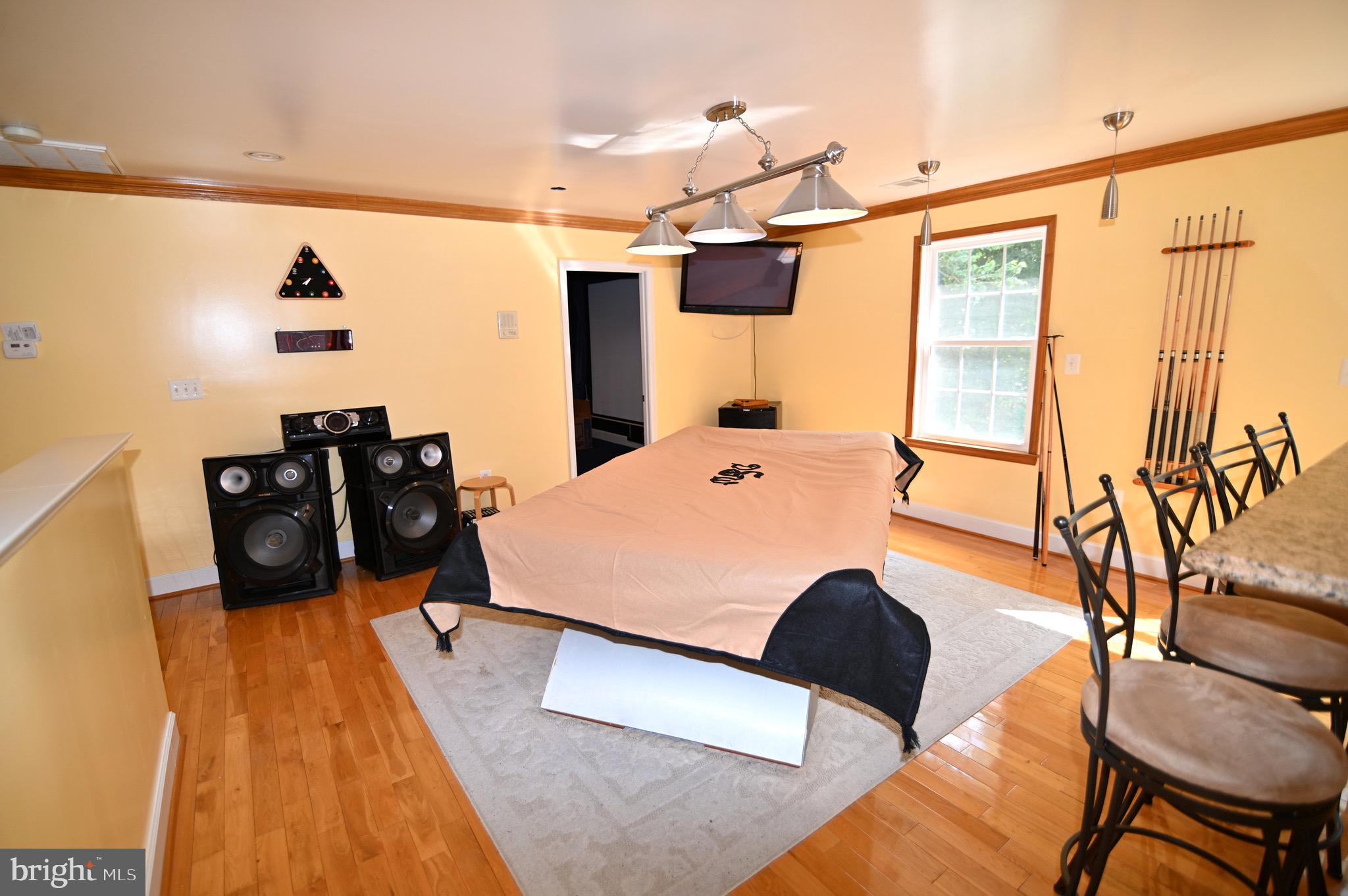 3407 Wayneswood Road Fort Washington, MD 20744 - Photo 38 of 70 a room with table chairs and wooden floor