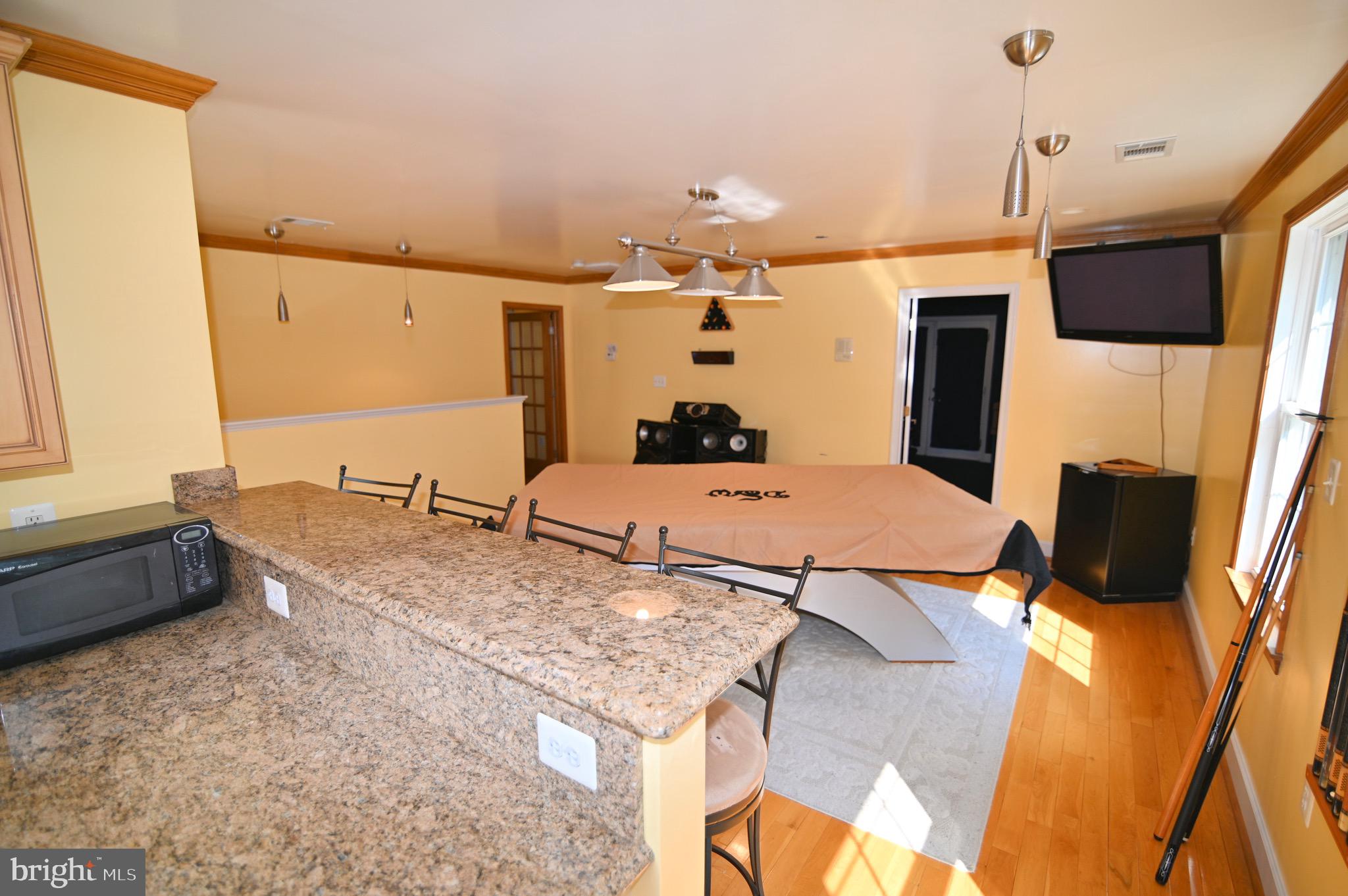 3407 Wayneswood Road Fort Washington, MD 20744 - Photo 43 of 70 a dining room with a table and chairs