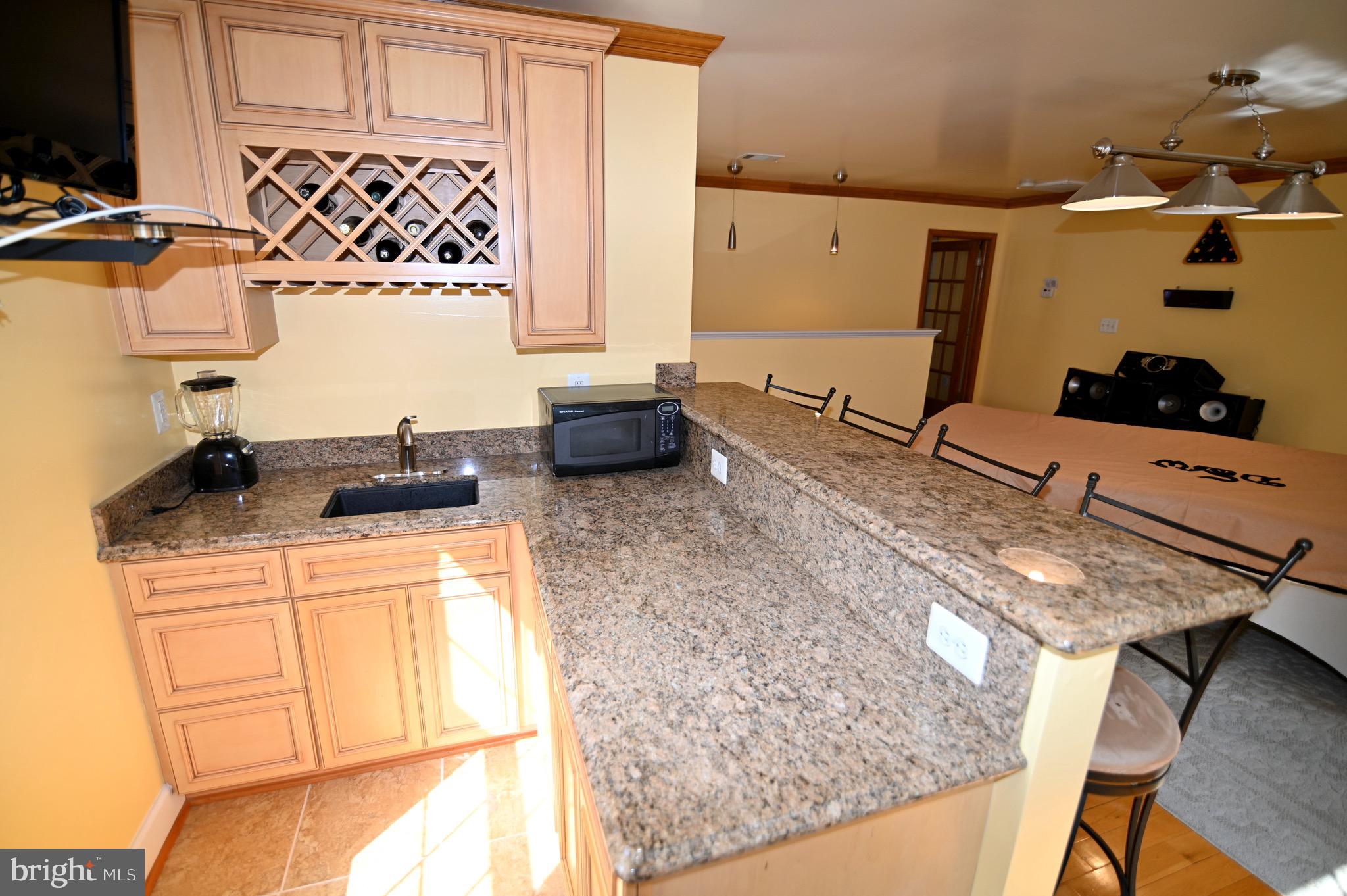 3407 Wayneswood Road Fort Washington, MD 20744 - Photo 44 of 70 a kitchen with stainless steel appliances granite countertop a sink stove and cabinets