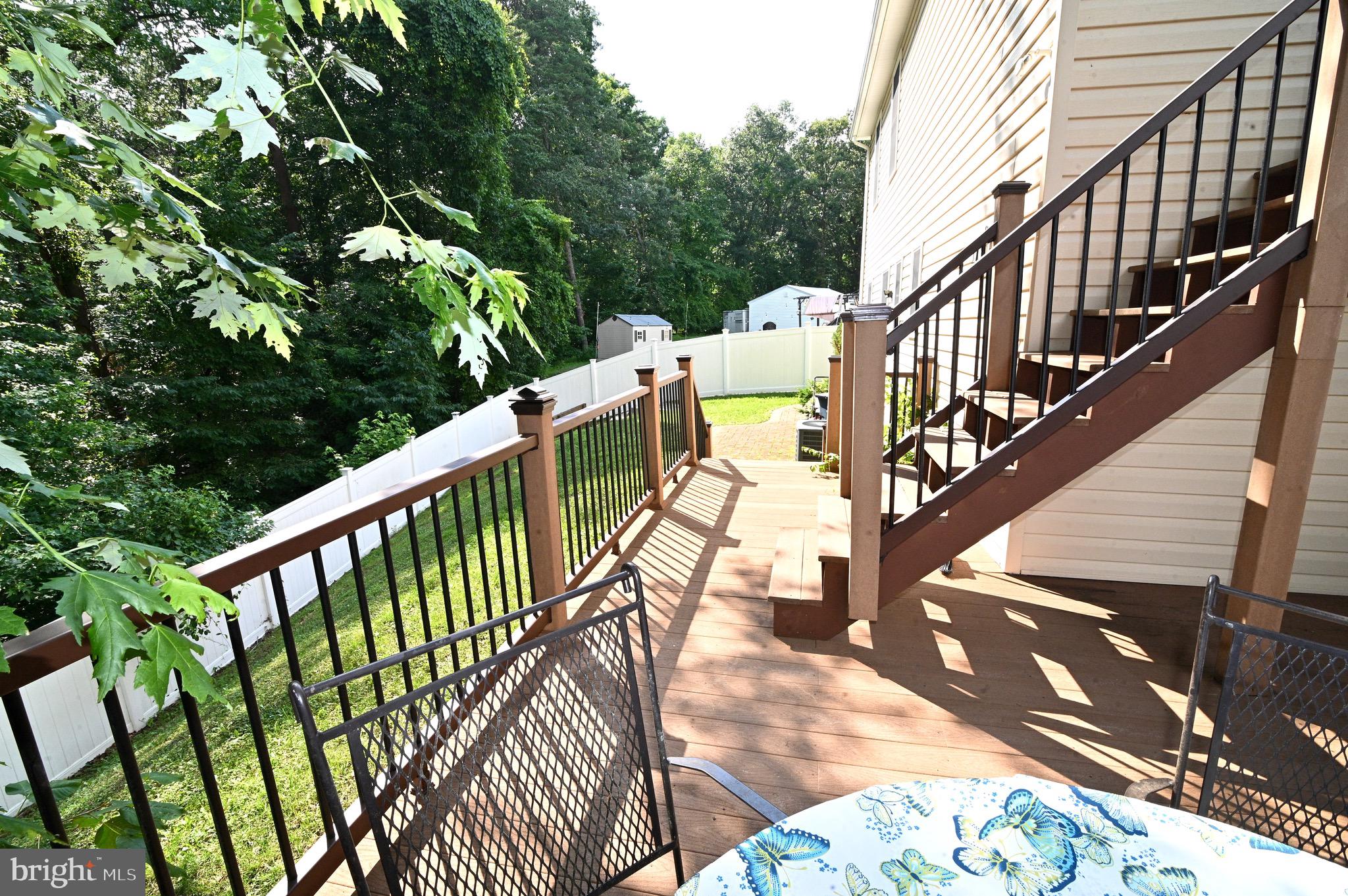 3407 Wayneswood Road Fort Washington, MD 20744 - Photo 57 of 70 a balcony with wooden floor stairs and wooden fence