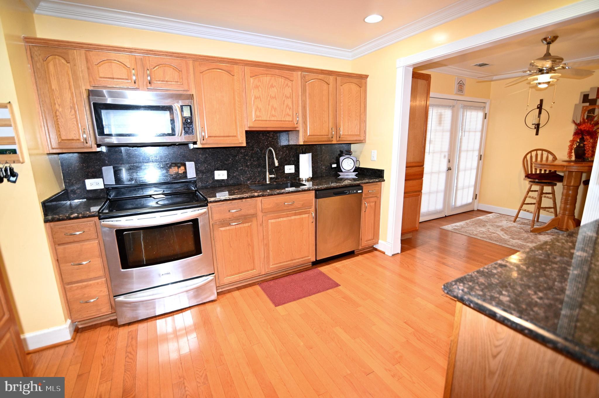 3407 Wayneswood Road Fort Washington, MD 20744 - Photo 9 of 70 a kitchen with stainless steel appliances granite countertop a stove a sink and a refrigerator