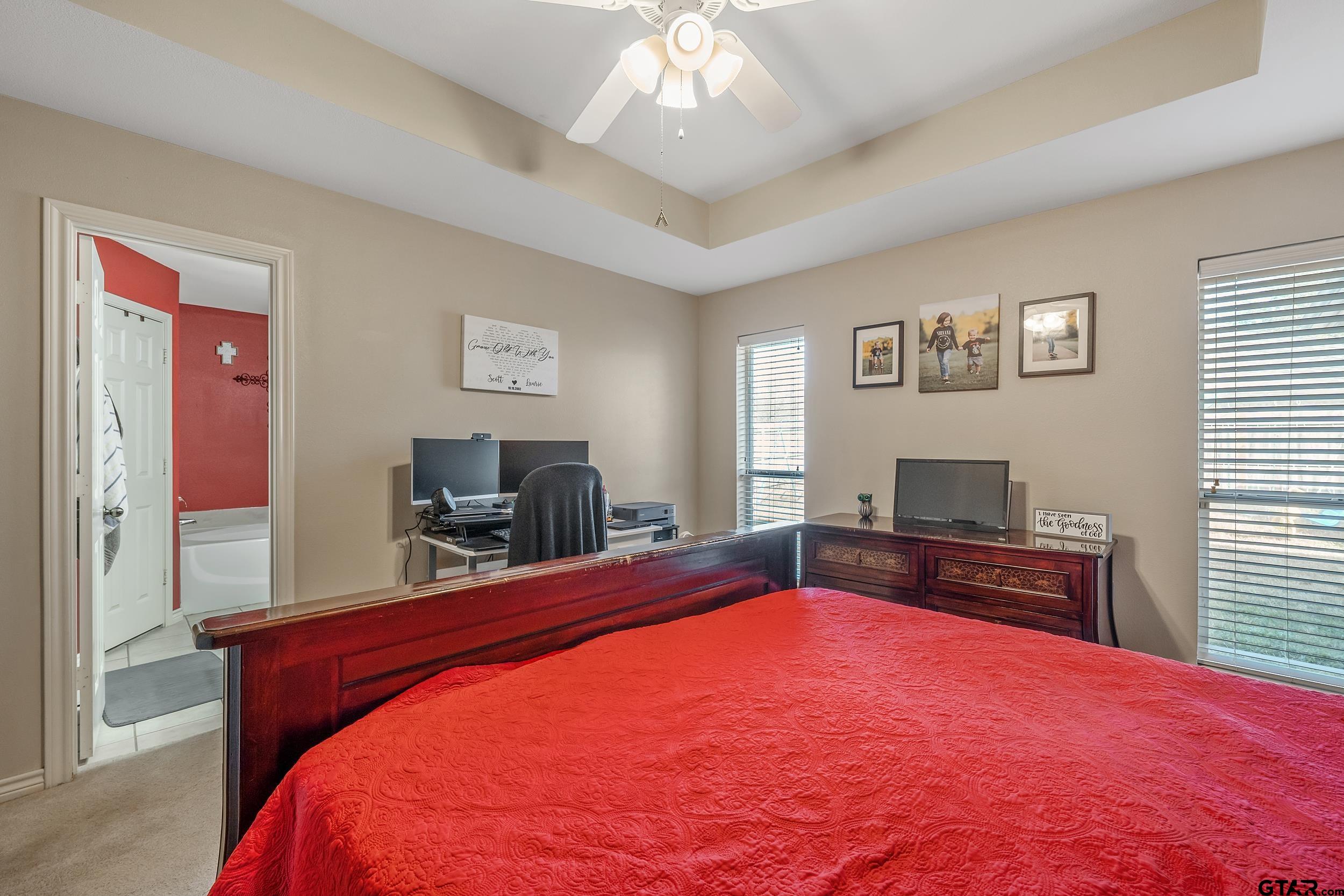 20081 Bluegrass Circle Flint, TX 75762 - Photo 13 of 24 a bedroom with a bed and a flat screen tv