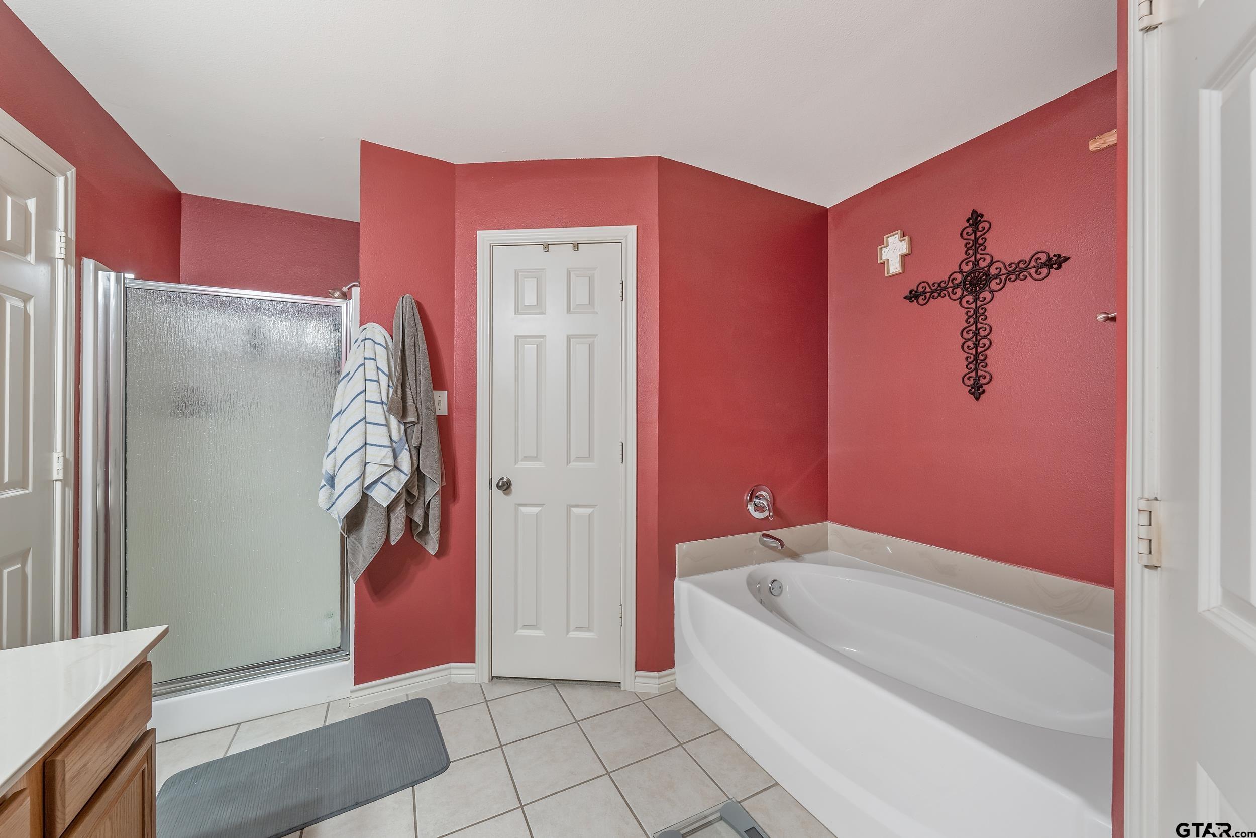20081 Bluegrass Circle Flint, TX 75762 - Photo 14 of 24 a spacious bathroom with a bathtub and shower