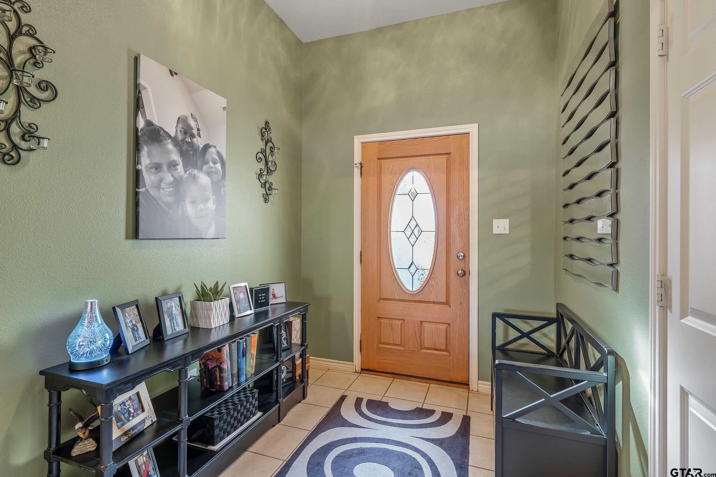 20081 Bluegrass Circle Flint, TX 75762 - Photo 2 of 24 a room with furniture a rug and a window