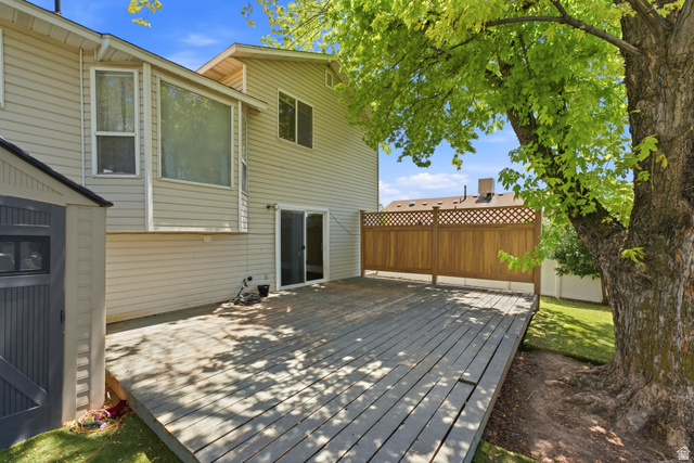 2475 Church Street Layton, UT 84040 - Photo 23 of 27 Spacious outdoor deck featuring wood flooring and a privacy lattice fence