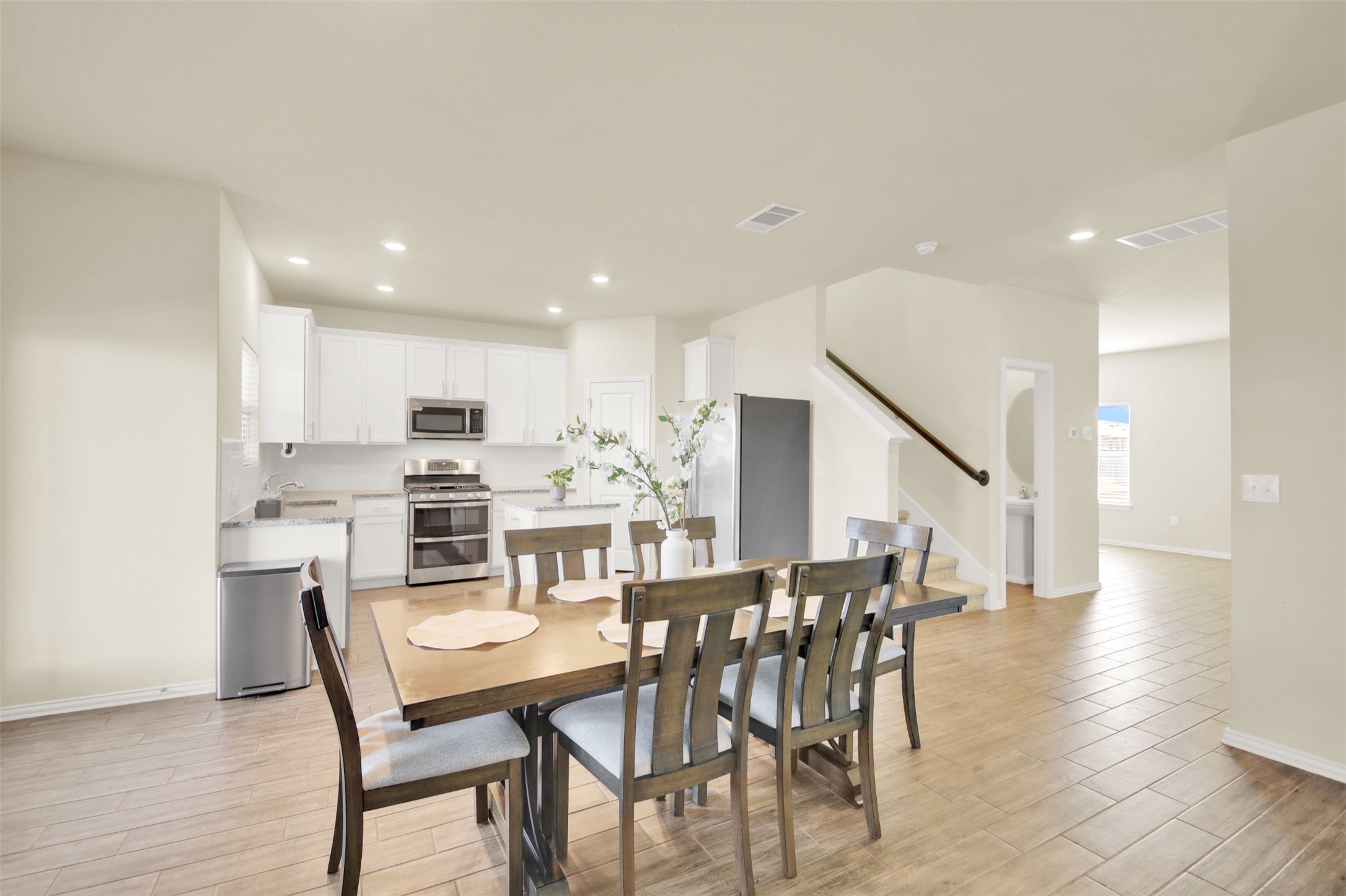 13716 Sugar Bush Path Manor, TX 78653 - Photo 19 of 37 Dining room featuring light wood-style flooring and recessed lighting
