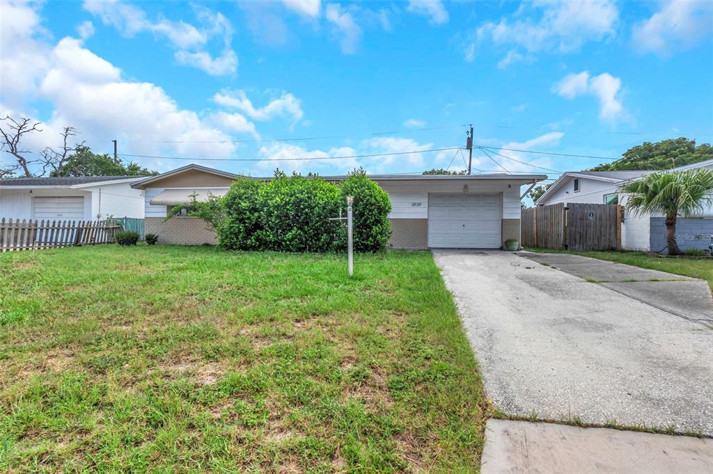 3636 Latimer Street New Port Richey, FL 34652 - Photo 1 of 1 a view of a backyard with a garden