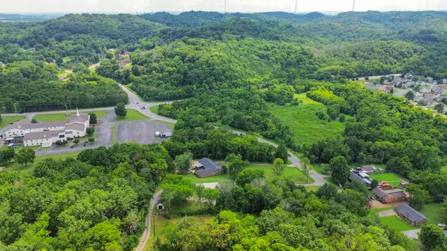 an aerial view of a house with mountain view