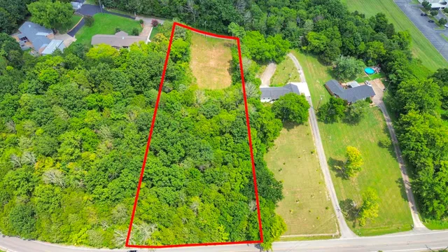 an aerial view of residential house with an outdoor space
