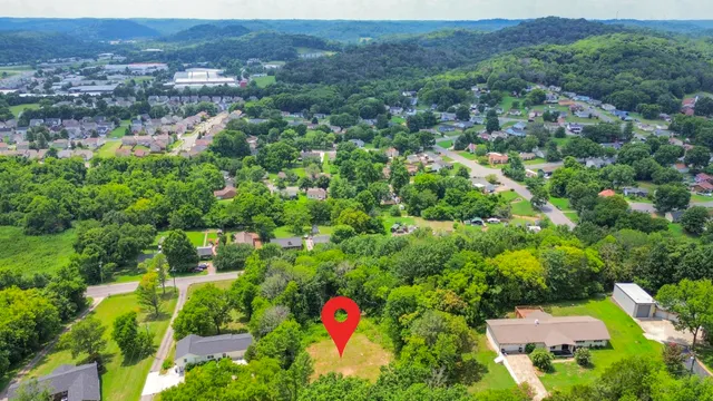 an aerial view of residential house and outdoor space