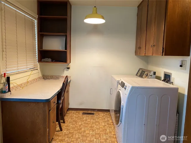 an empty room with wooden floor and fireplace