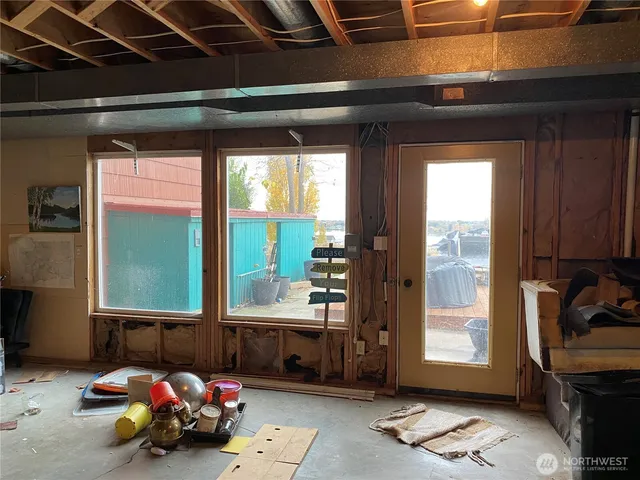 a bathroom with a sink mirror and toilet