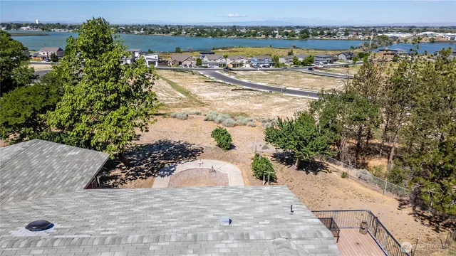 an aerial view of a residential building and lake view