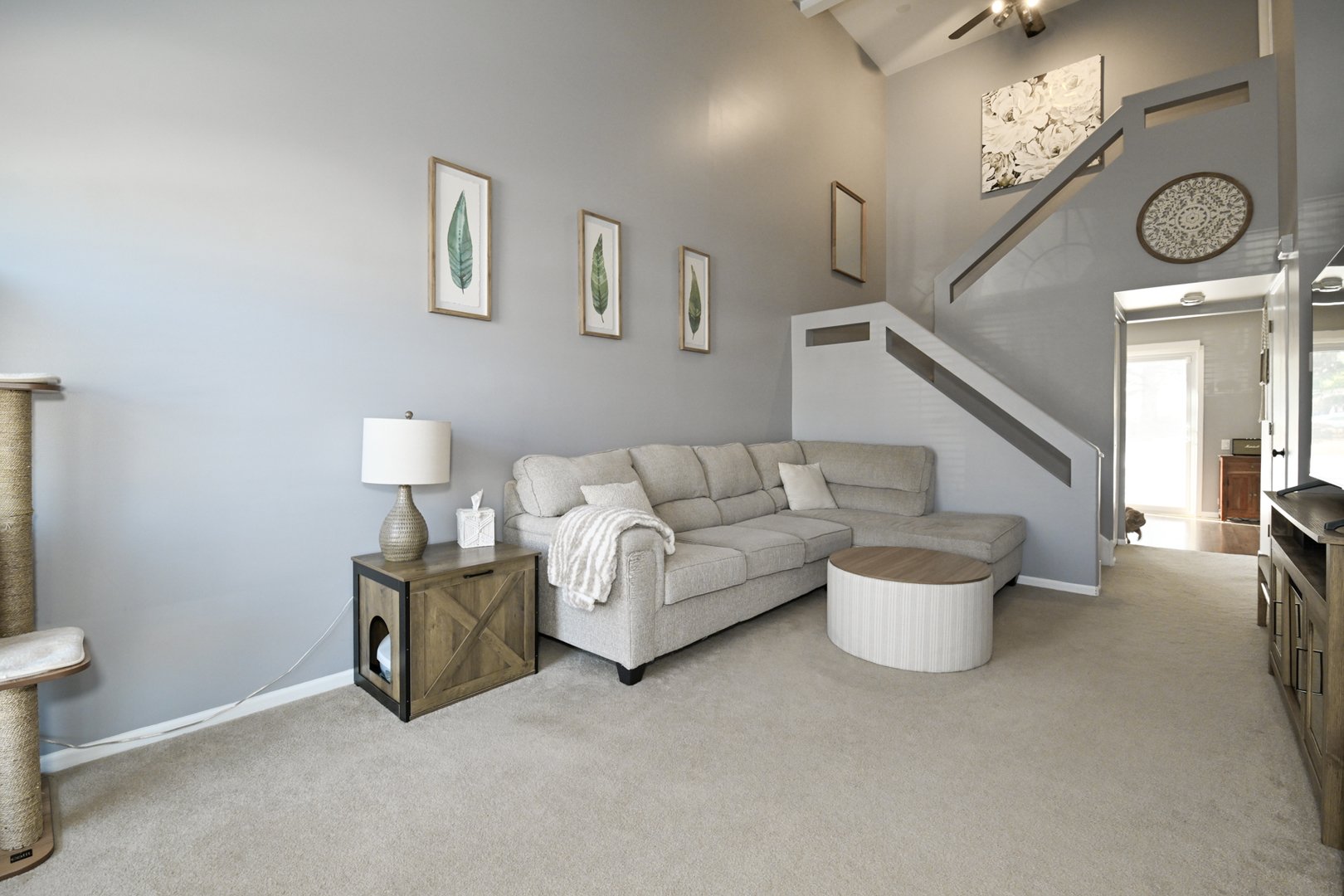 2092 Muirfield Circle Elgin, IL 60123 - Photo 2 of 14 a living room with furniture a large window and a chandelier