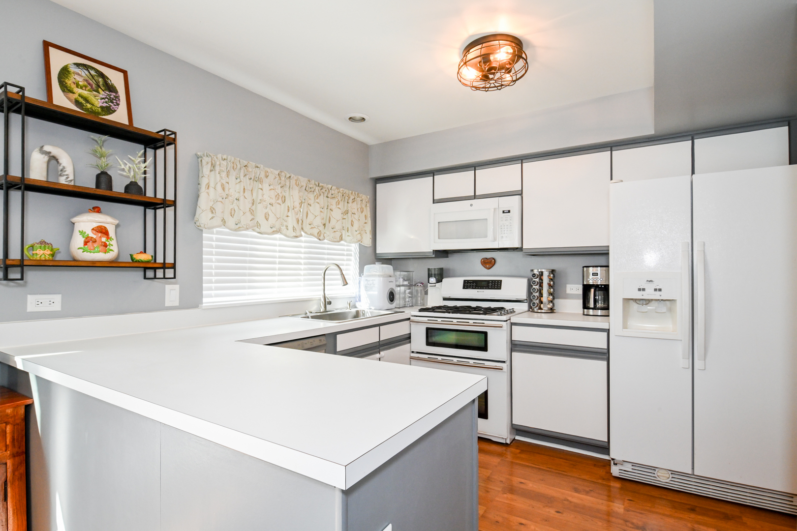 2092 Muirfield Circle Elgin, IL 60123 - Photo 9 of 14 a kitchen with stainless steel appliances a stove a sink and a refrigerator