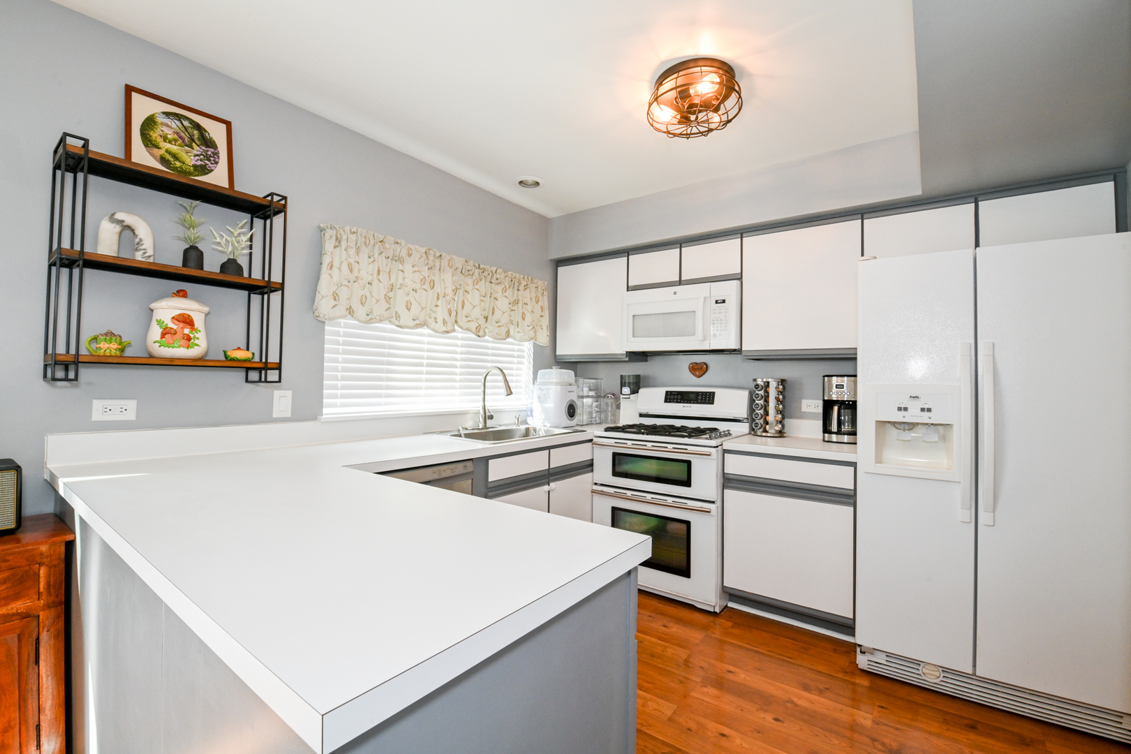 2092 Muirfield Circle Elgin, IL 60123 - Photo 10 of 14 a kitchen with cabinets appliances and a window