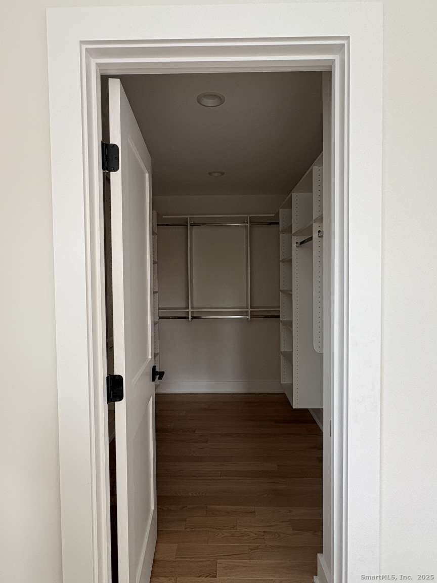 137 Millard Street Fairfield, CT 06824 - Photo 14 of 19 a view of walk in closet with empty racks