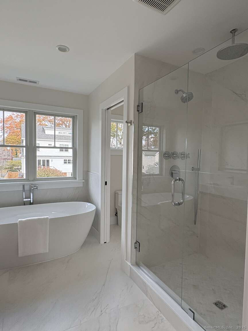 137 Millard Street Fairfield, CT 06824 - Photo 16 of 19 a spacious bathroom with sink shower and a bathtub