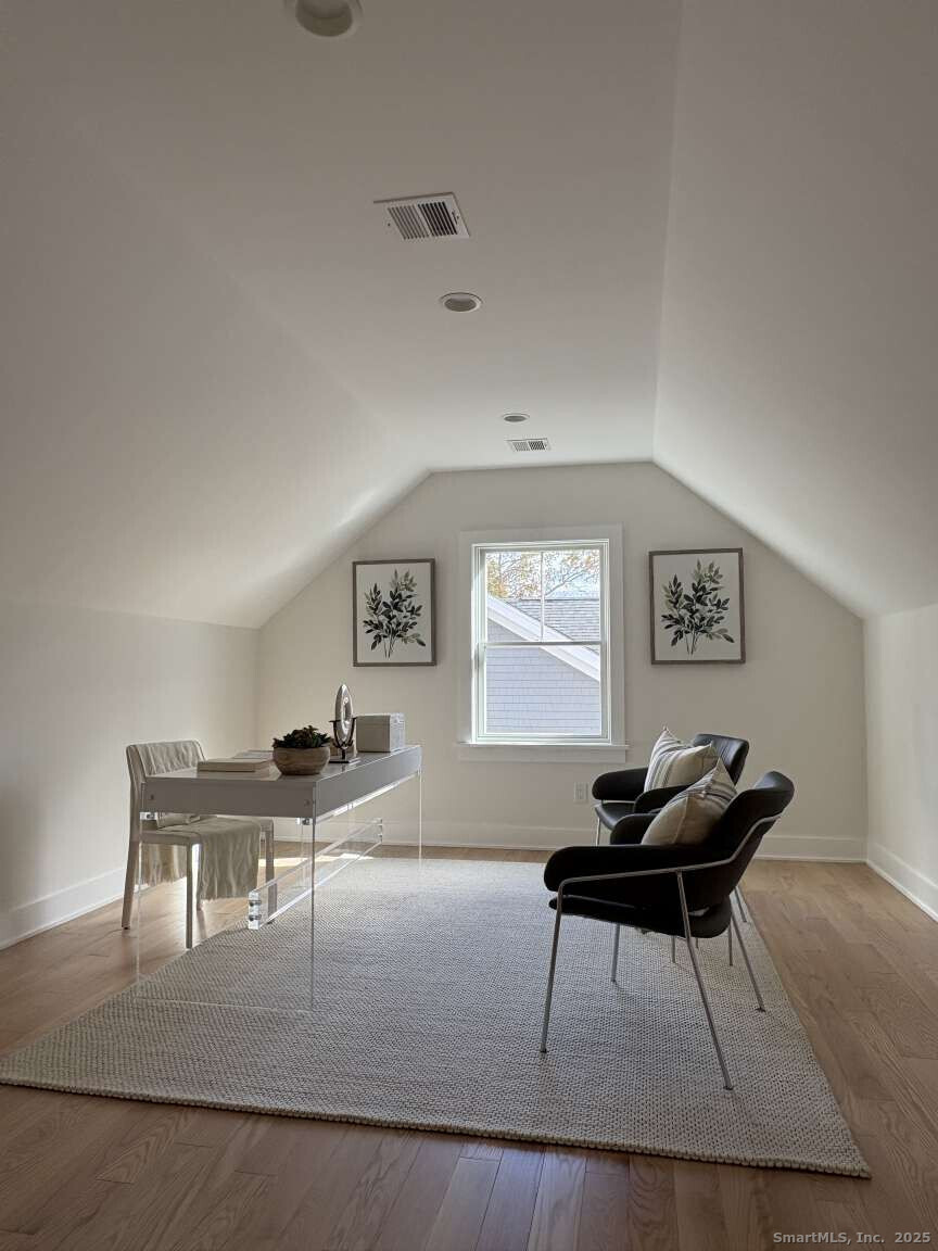 137 Millard Street Fairfield, CT 06824 - Photo 18 of 19 a living room with furniture and a piano table