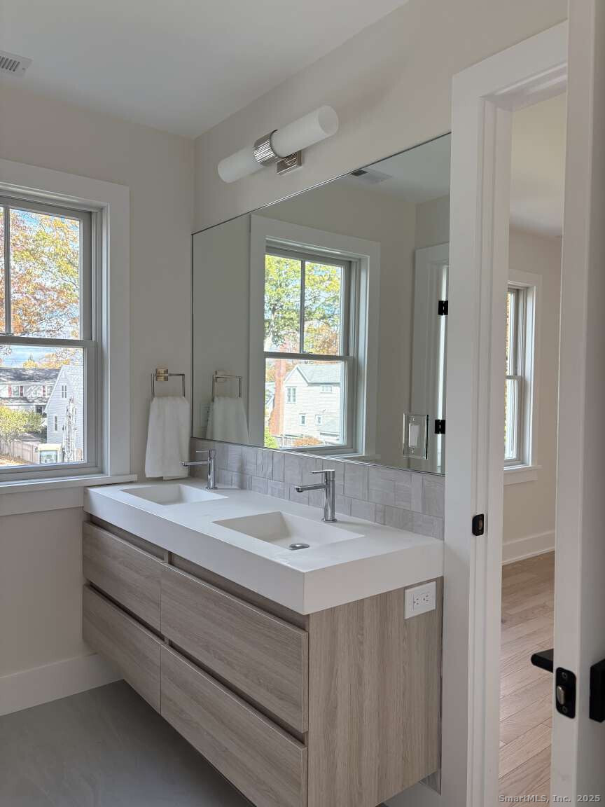 137 Millard Street Fairfield, CT 06824 - Photo 10 of 19 a bathroom with a sink and a bathtub