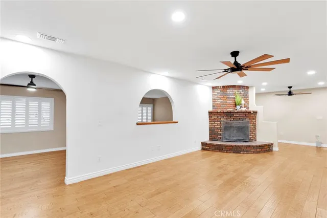 a view of a livingroom with a ceiling fan and window