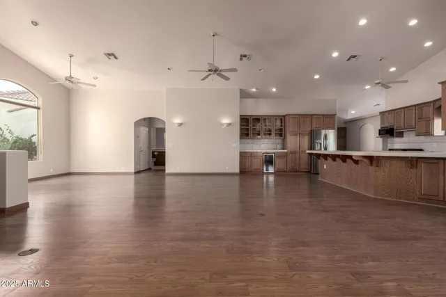 a view of kitchen and kitchen with stainless steel appliances