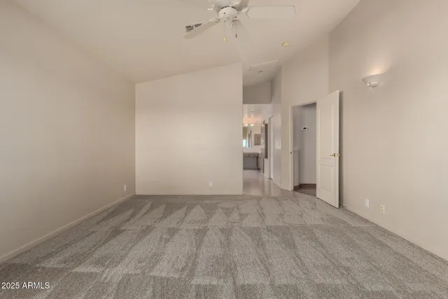 a view of empty room with a fireplace