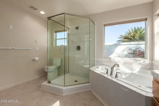 a bathroom with a shower and a sink