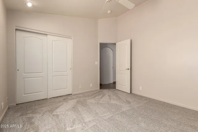 an empty room with closet area